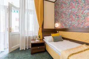 Posteľ alebo postele v izbe v ubytovaní Hotel Arcus Garden