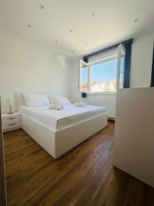 Posteľ alebo postele v izbe v ubytovaní Vila Zrina - Apartmani