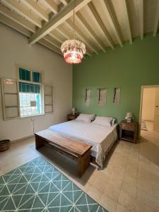 Ένα ή περισσότερα κρεβάτια σε δωμάτιο στο Beit Lena