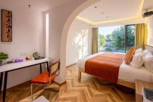 Suzhou Zhouzhuang Slowlife River View lnn客房内的一张或多张床位