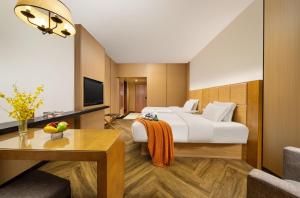 TV a/nebo společenská místnost v ubytování Mellow Orange Hotel
