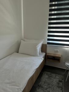Postel nebo postele na pokoji v ubytování Prenoćište CMA