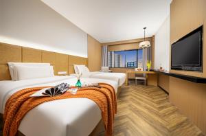 TV a/nebo společenská místnost v ubytování Mellow Orange Hotel