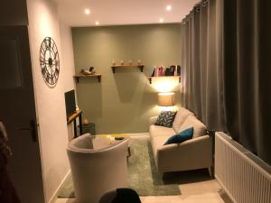 Χώρος καθιστικού στο Le Bienvenue Chez Toi