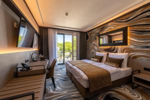 Postel nebo postele na pokoji v ubytování Hotel Debrecen