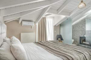 Postel nebo postele na pokoji v ubytování Andromeda Villa