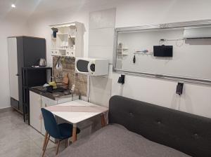 a room with a couch and a table and a kitchen at Silver Apartments in Bogács