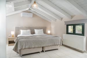Postel nebo postele na pokoji v ubytování Andromeda Villa + 37 fotografií