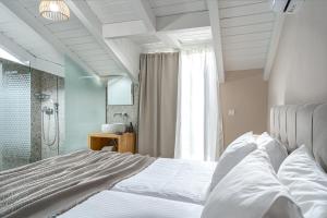 Postel nebo postele na pokoji v ubytování Andromeda Villa