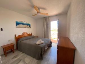 Postel nebo postele na pokoji v ubytování Duplex Turisticos MojaMar Playa