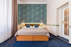 Posteľ alebo postele v izbe v ubytovaní Hotel Arcus Garden