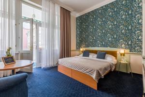 Posteľ alebo postele v izbe v ubytovaní Hotel Arcus Garden