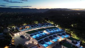 an aerial view of a hotel at night at Hotel St.John Suites Adults Only in Tsilivi