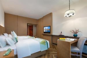 Postel nebo postele na pokoji v ubytování Mellow Orange Hotel