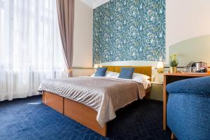 Posteľ alebo postele v izbe v ubytovaní Hotel Arcus Garden