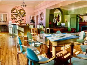 a dining room with a glass table and chairs at Villa AJNA Bayonne in Bayonne