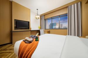 TV a/nebo společenská místnost v ubytování Mellow Orange Hotel