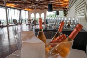 two bottles of champagne on a counter in a restaurant at Hotel Monteconero in Sirolo