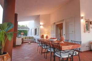 a dining room with a table and chairs at TD Villa Marinesca Typical Villa with Pool in Polignano a Mare +41 photos
