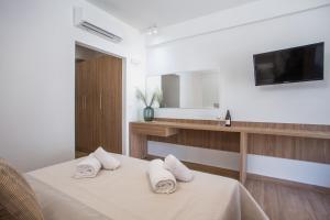 Posteľ alebo postele v izbe v ubytovaní Cactus Suites