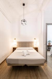 Posteľ alebo postele v izbe v ubytovaní Live in Chianti Apartaments by Concept Flats
