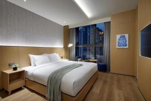 L7 HAEUNDAE by LOTTE客房内的一张或多张床位