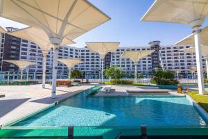 Bazén v ubytování Nyoum Porto New Cairo nebo v jeho okolí