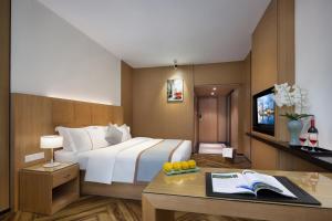 TV a/nebo společenská místnost v ubytování Mellow Orange Hotel