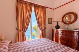A bed or beds in a room at Villa Trara