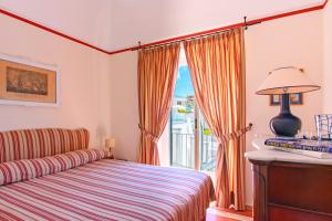 A bed or beds in a room at Villa Trara