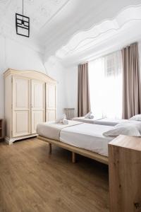 Posteľ alebo postele v izbe v ubytovaní Live in Chianti Apartaments by Concept Flats