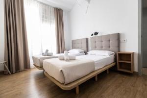 Posteľ alebo postele v izbe v ubytovaní Live in Chianti Apartaments by Concept Flats