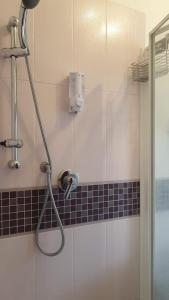 a shower in a bathroom with a shower head at Domus Mari in Fiuggi