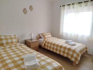 Postel nebo postele na pokoji v ubytování Casinha da Glória + 10 fotografií