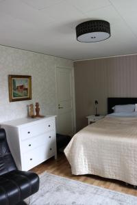 Postel nebo postele na pokoji v ubytování ÖstraVi Visby 2 rok stor altan