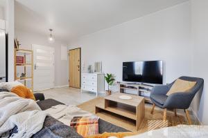 Telewizja i/lub zestaw kina domowego w obiekcie Central Park Supreme II by LookAp