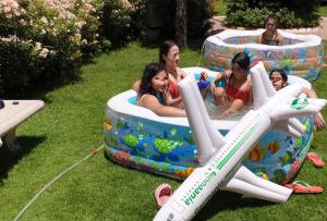 a group of people playing in an inflatable pool at Luxury Appartement in Trâblous