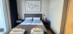 Ένα ή περισσότερα κρεβάτια σε δωμάτιο στο Apartament Joanna Jantar Resort by TriApart