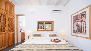a bedroom with a large bed in a room at Lavender Studio in Patmos