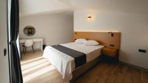 Ένα ή περισσότερα κρεβάτια σε δωμάτιο στο - Meta Homes - +60 φωτογραφίες