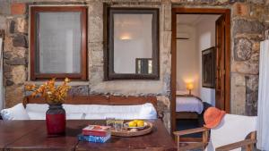a room with a table with a bowl of fruit on it at Lavender Studio in Patmos