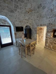 TV a/nebo společenská místnost v ubytování Il Trullo di Bina