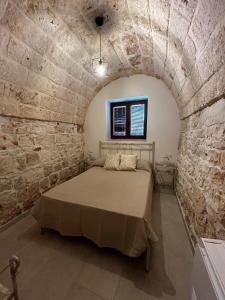 Postel nebo postele na pokoji v ubytování Il Trullo di Bina