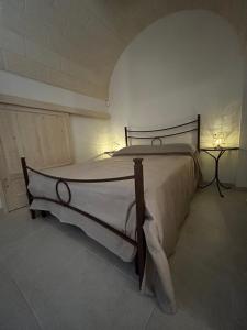 Postel nebo postele na pokoji v ubytování Il Trullo di Bina
