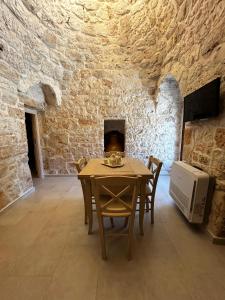 TV a/nebo společenská místnost v ubytování Il Trullo di Bina
