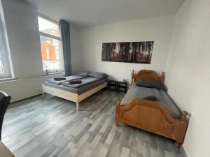 Postel nebo postele na pokoji v ubytování Schönes einfaches zentrales Zimmer in Oldenburg