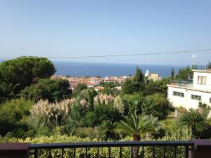 a view of the ocean from the balcony of a house at Residence Floritalia - Ricarica auto elettriche in Santa Domenica