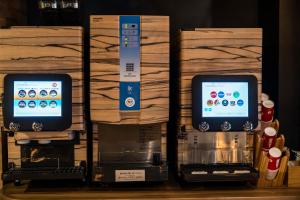 a display of an apple iphone and a coffee machine at Hotel Bali An Resort Shinjuku Forest in Tokyo +21 photos