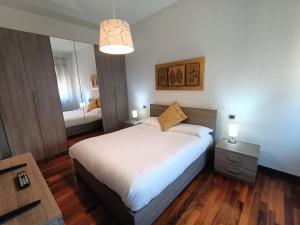 A bed or beds in a room at Style Homes Brera San Marco 29