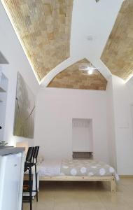 Ένα ή περισσότερα κρεβάτια σε δωμάτιο στο La Casetta di Porta Palermo